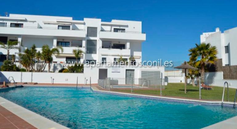 APARTAMENTOS TURÍSTICOS CONIL LUZ foto piscina fuente web alojamiento